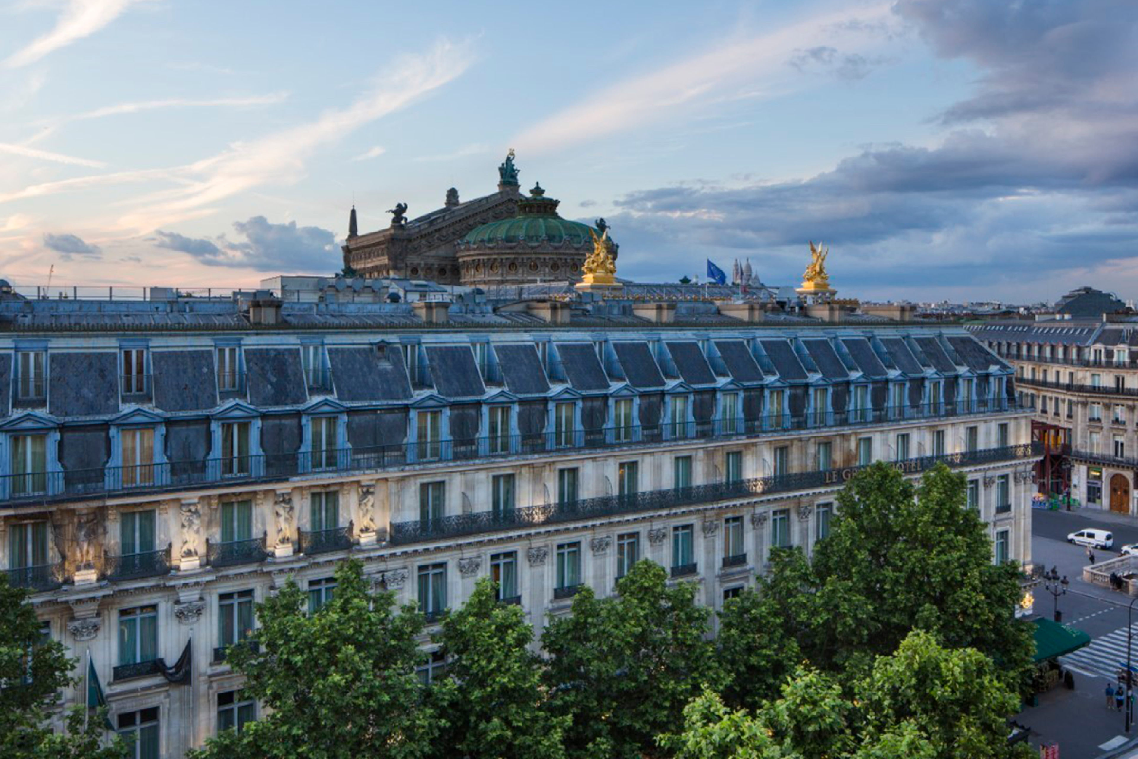 Large Parisian building lined with trees