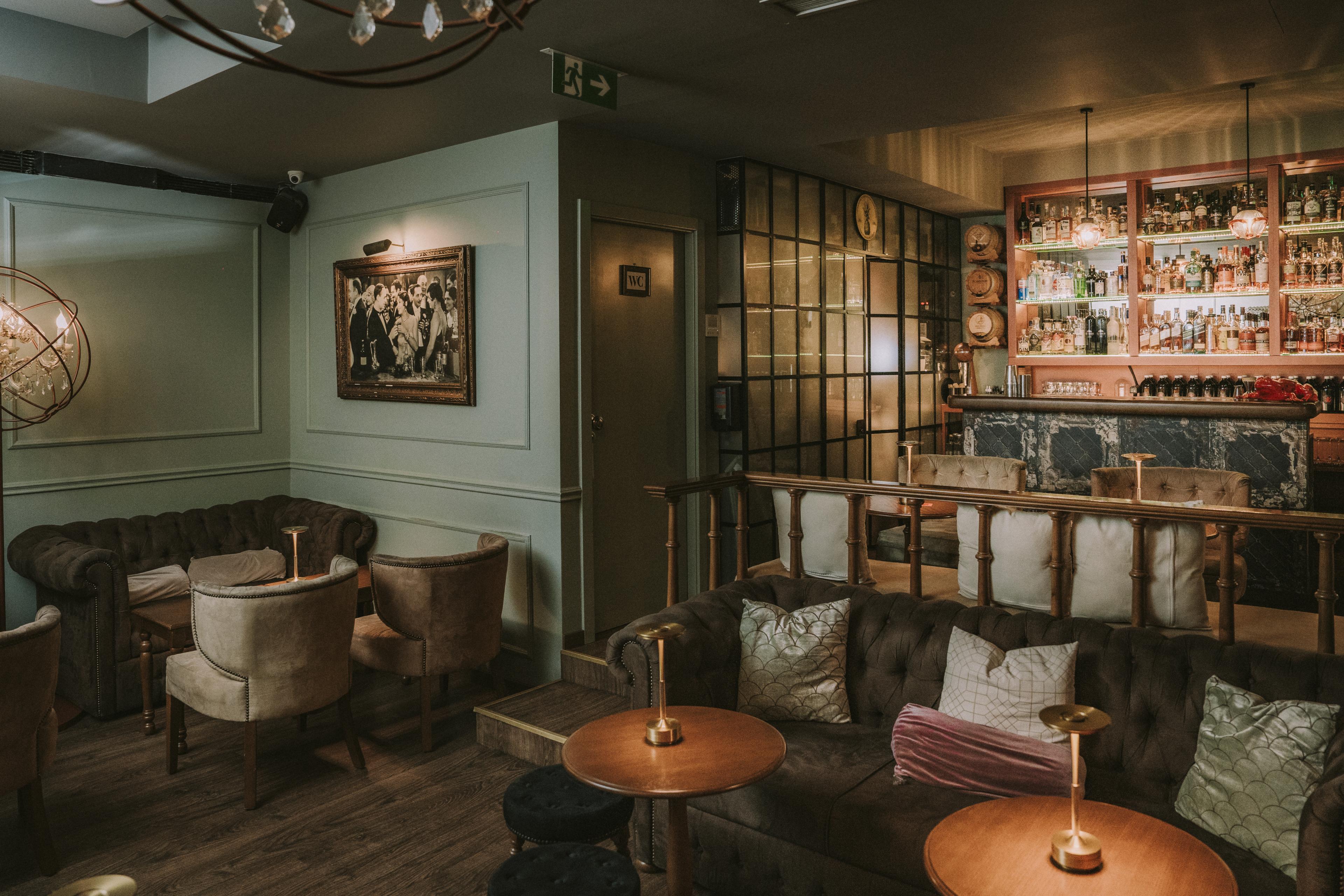 The interior of a bar and lounge area. 