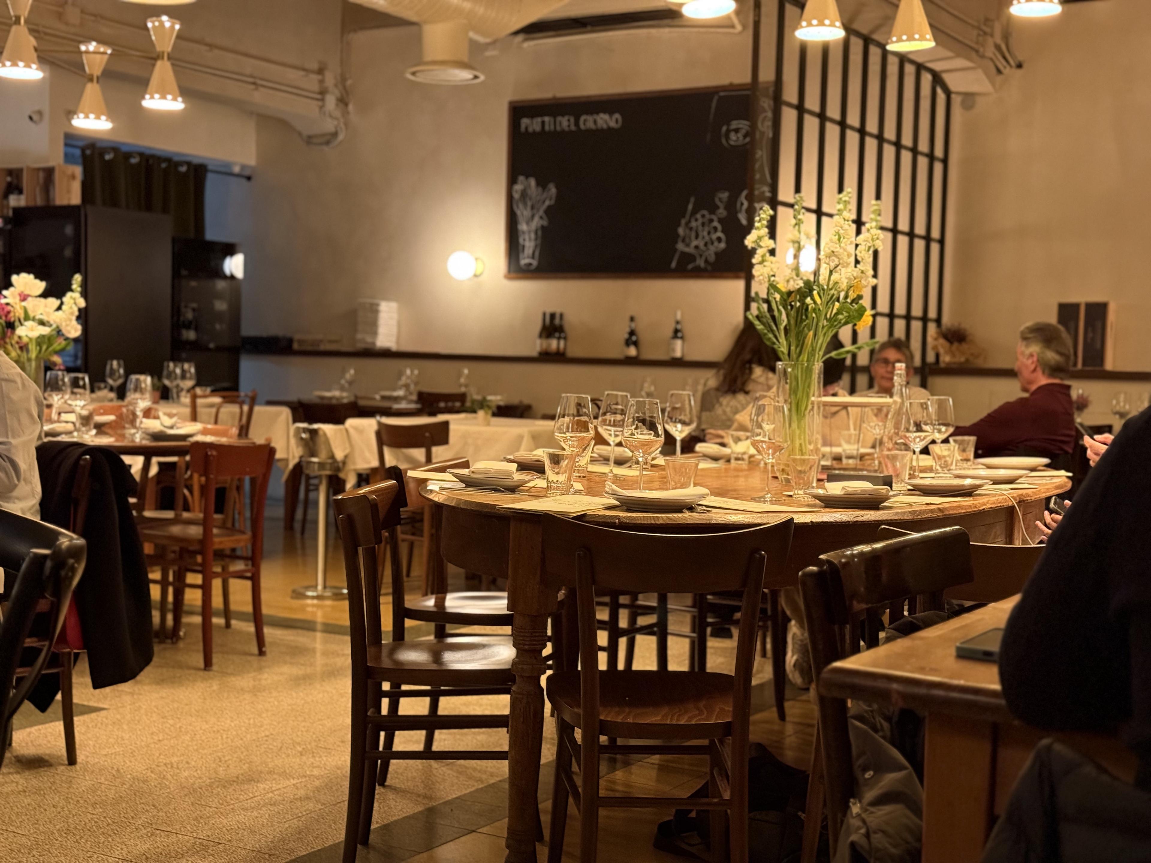 dining room with dim lighting and white tablecloths