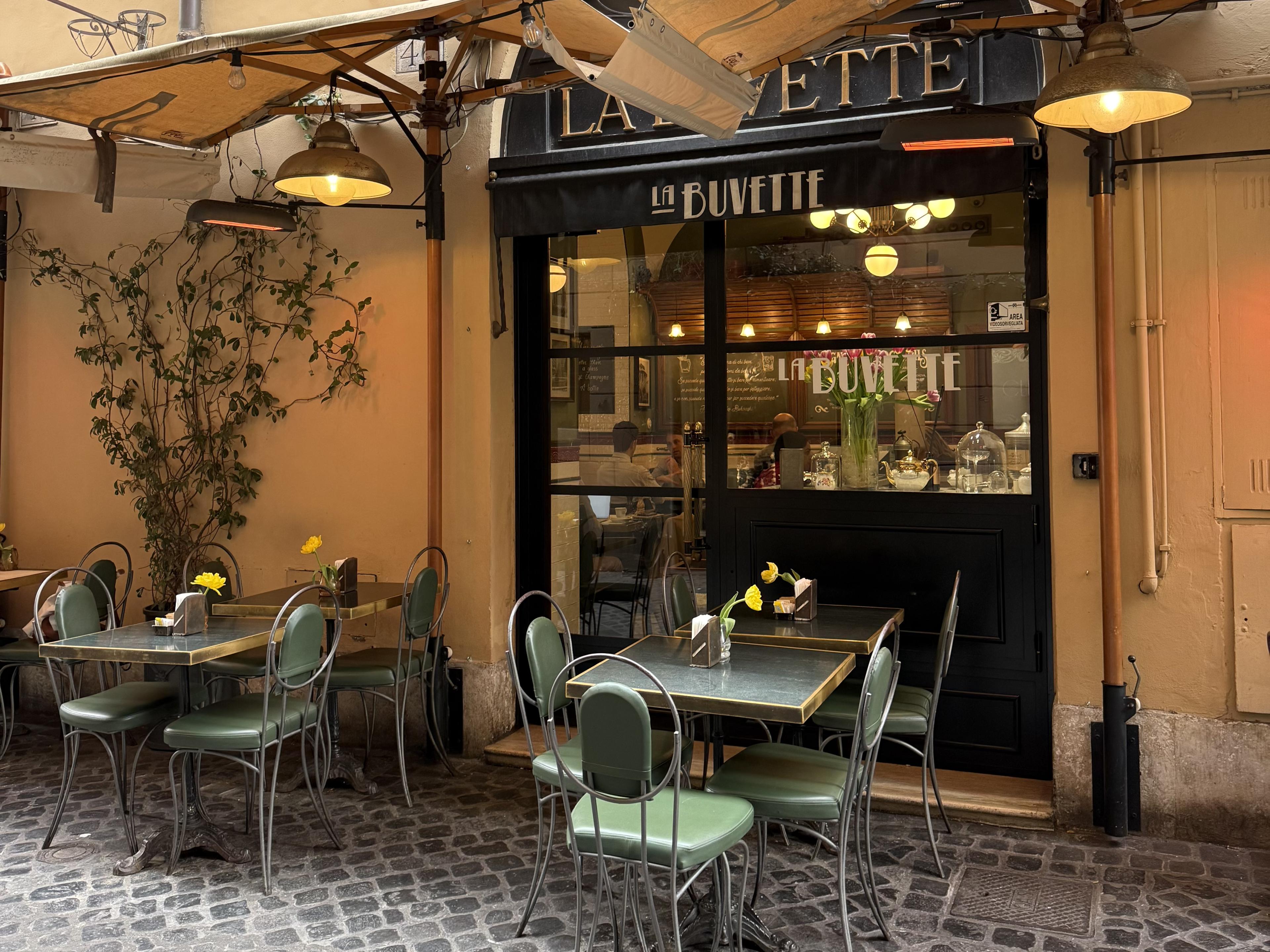 exterior of cafe in rome with sidewalk seating