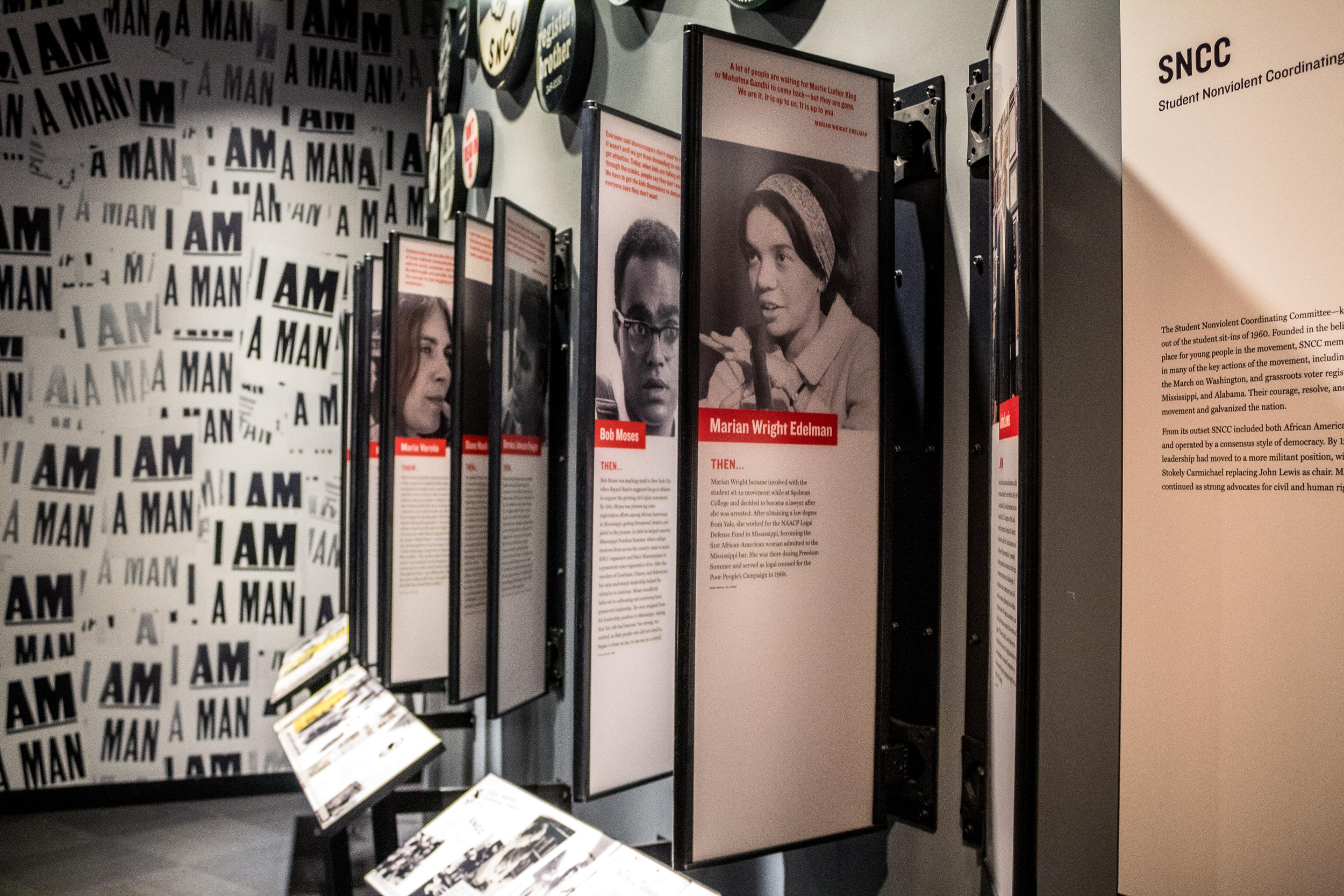 museum display of important African Americans with their photos and descriptions beneath displayed on wall placards
