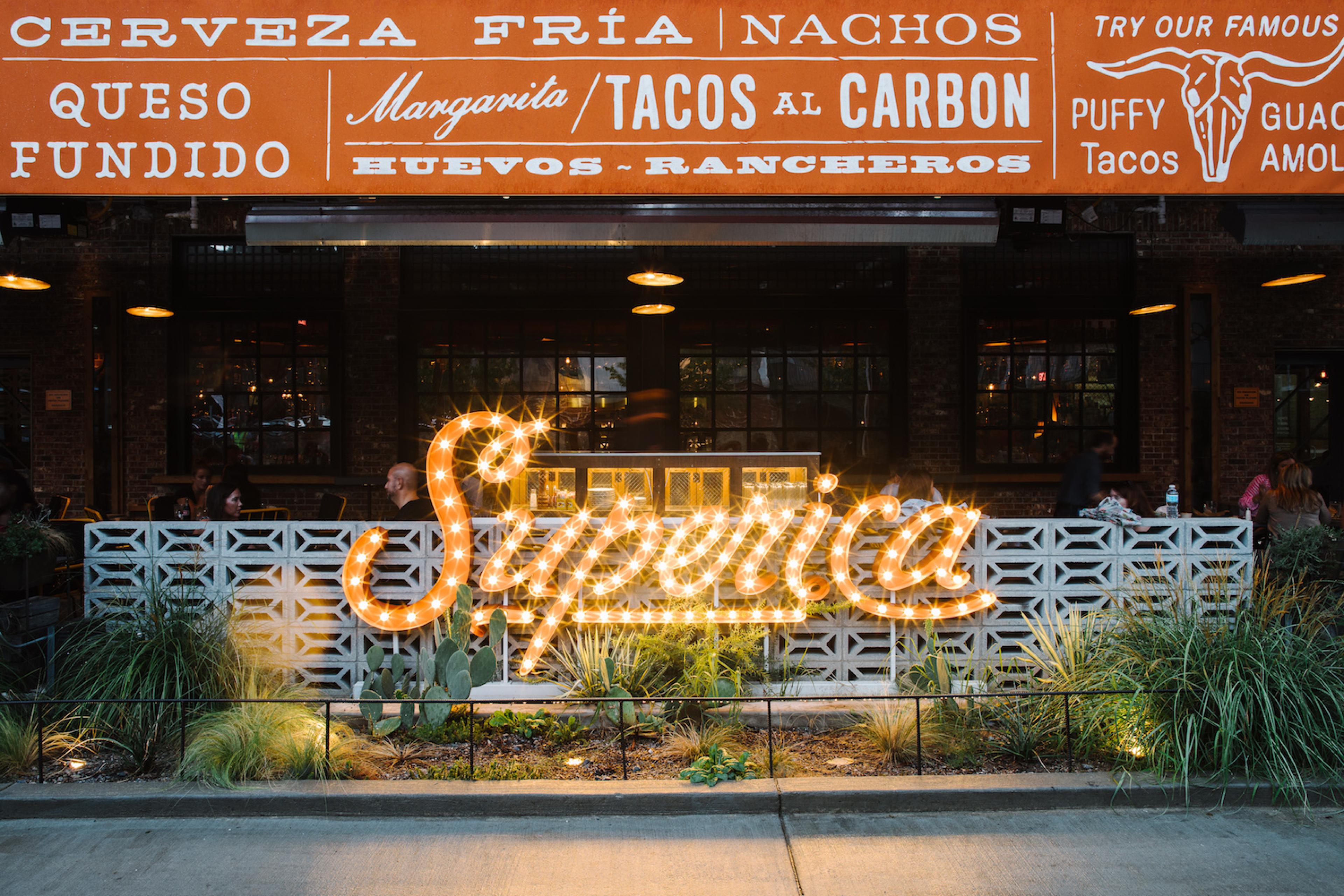 The exterior neon sign at Superica 