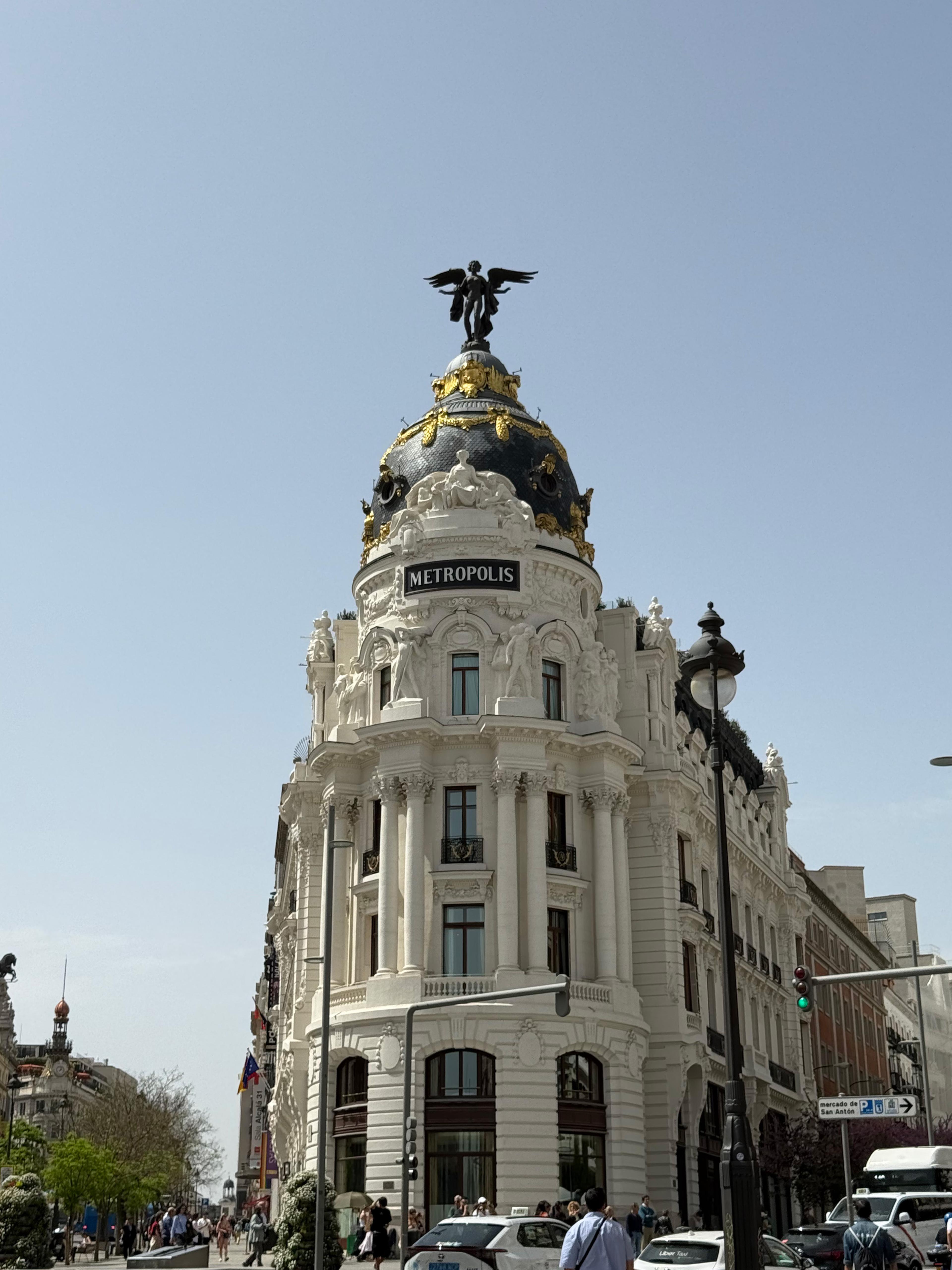 white marble building in with an angel statue on top