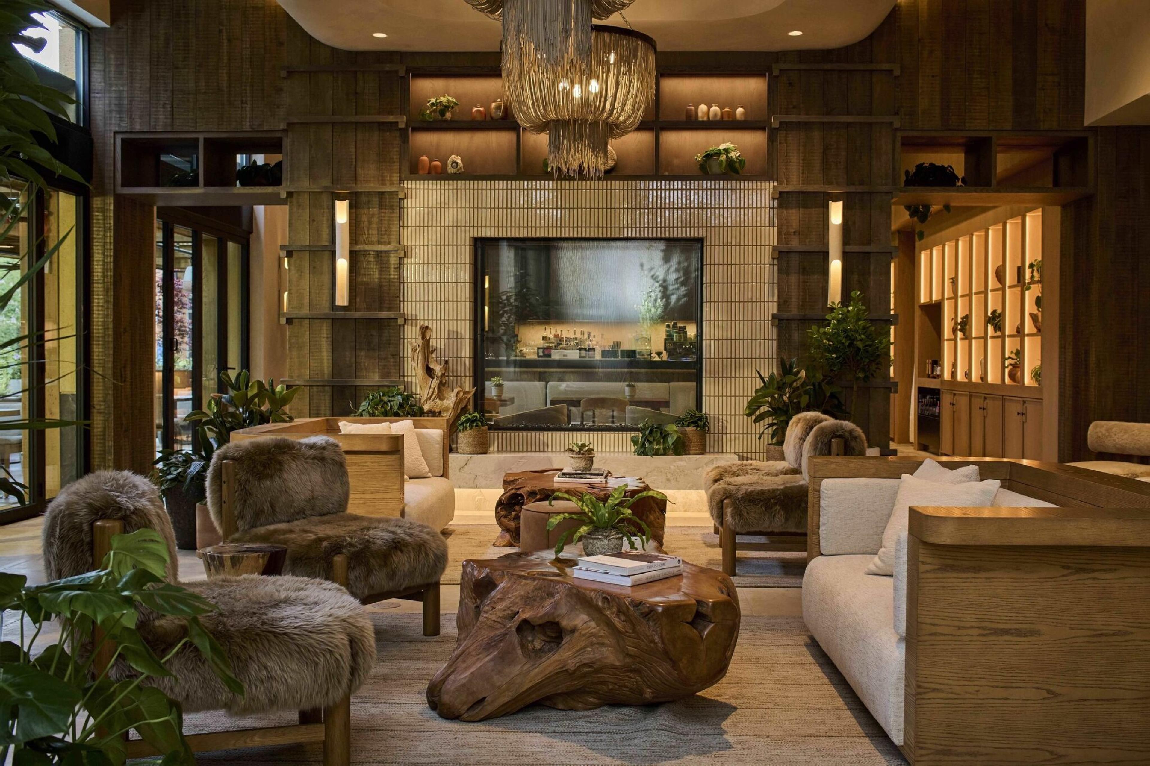 cozy, woodland-inspired lobby with natural wood cocktail table and couches