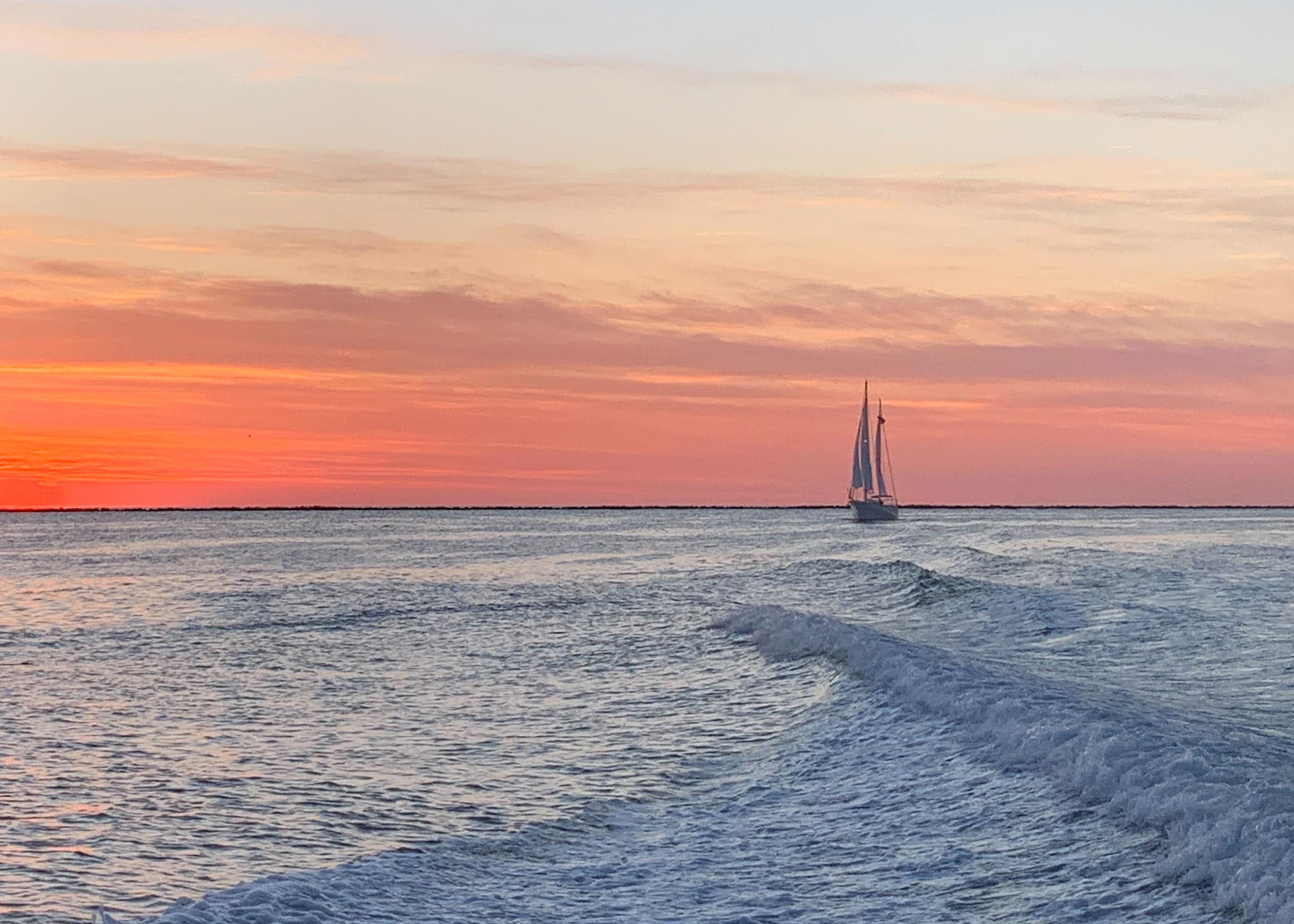 sunset over water near nantucket during nantucket boat charter