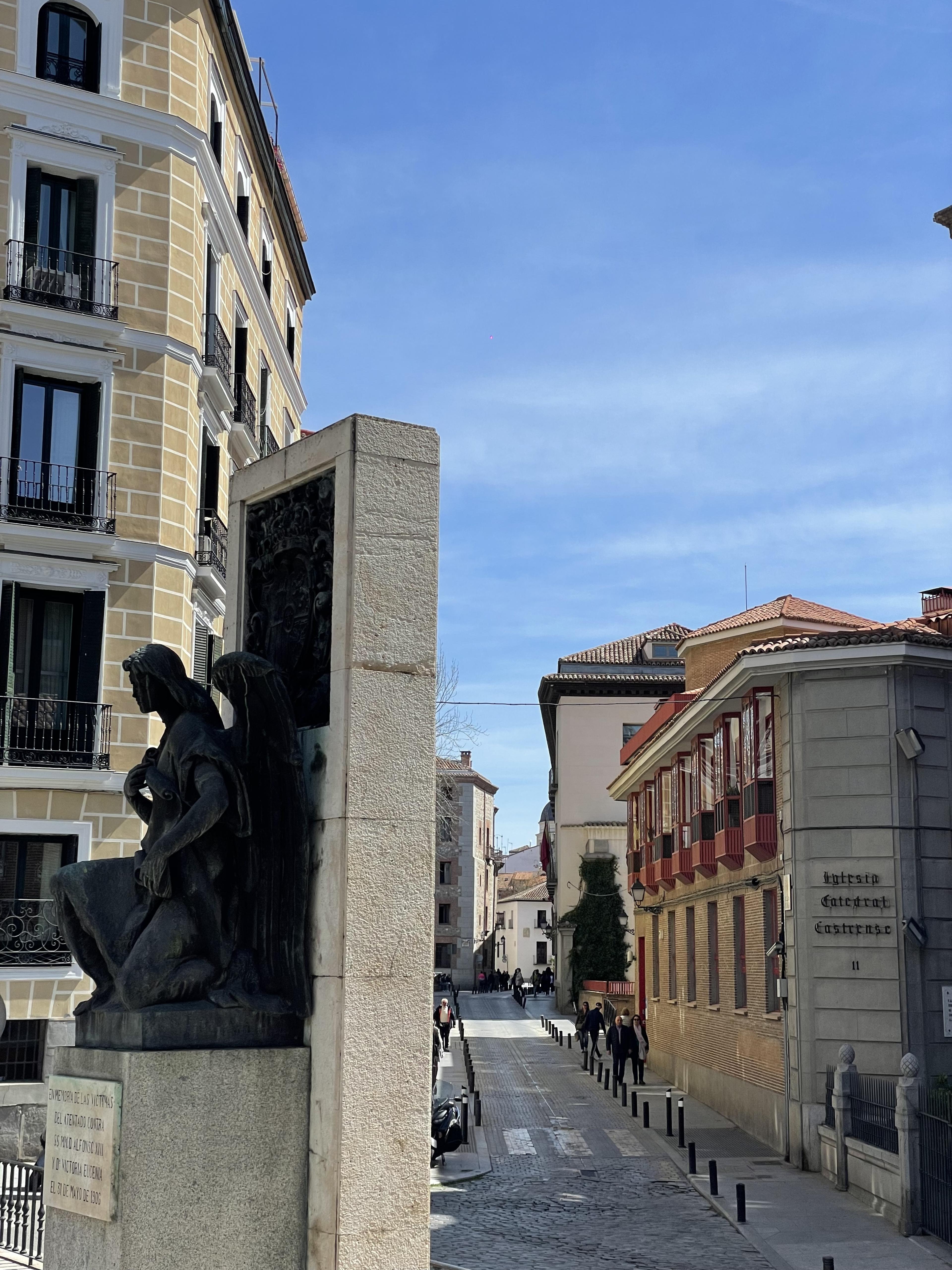 madrid historic street scene with statue