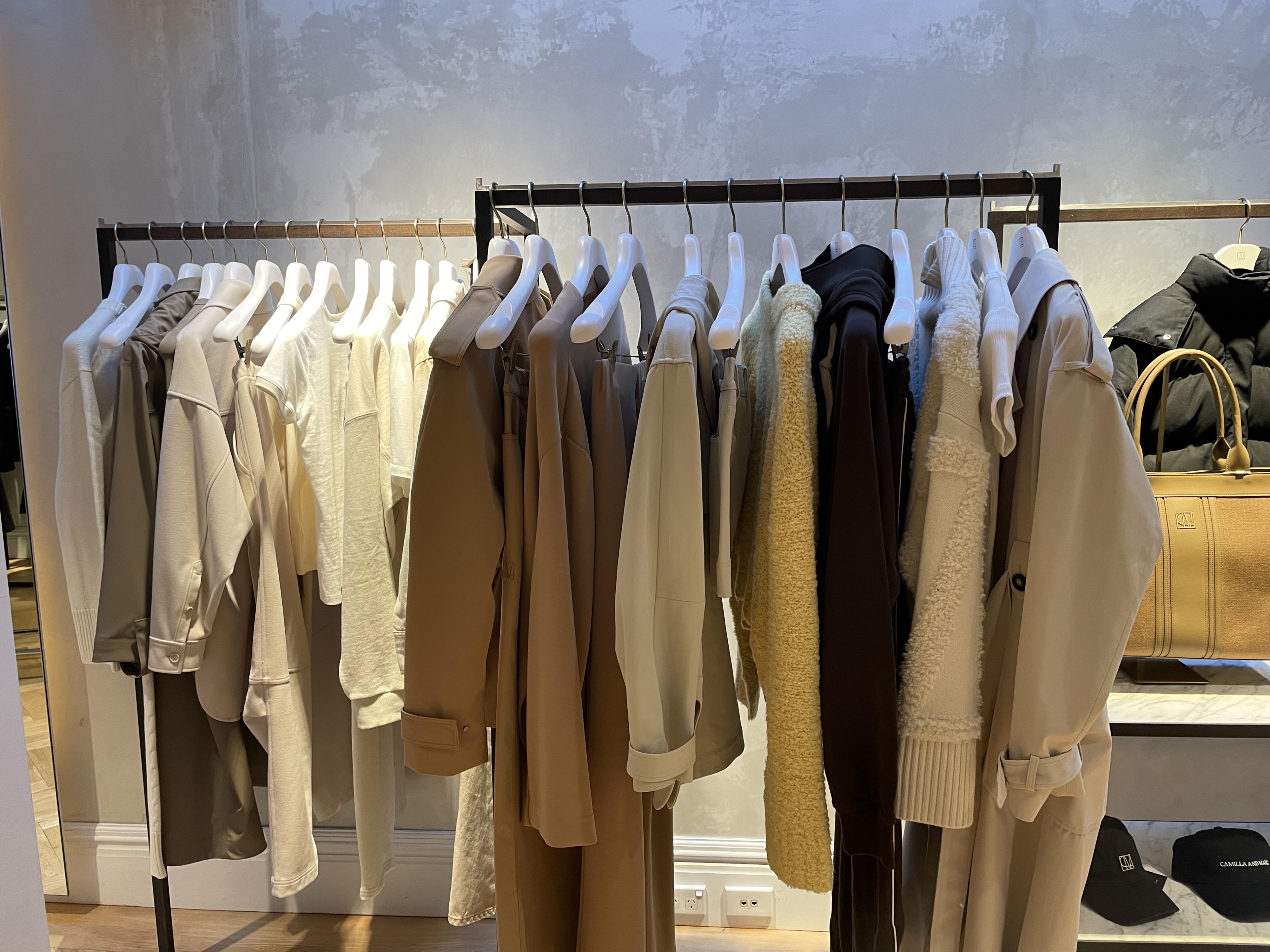 clothes on a rack at a store 