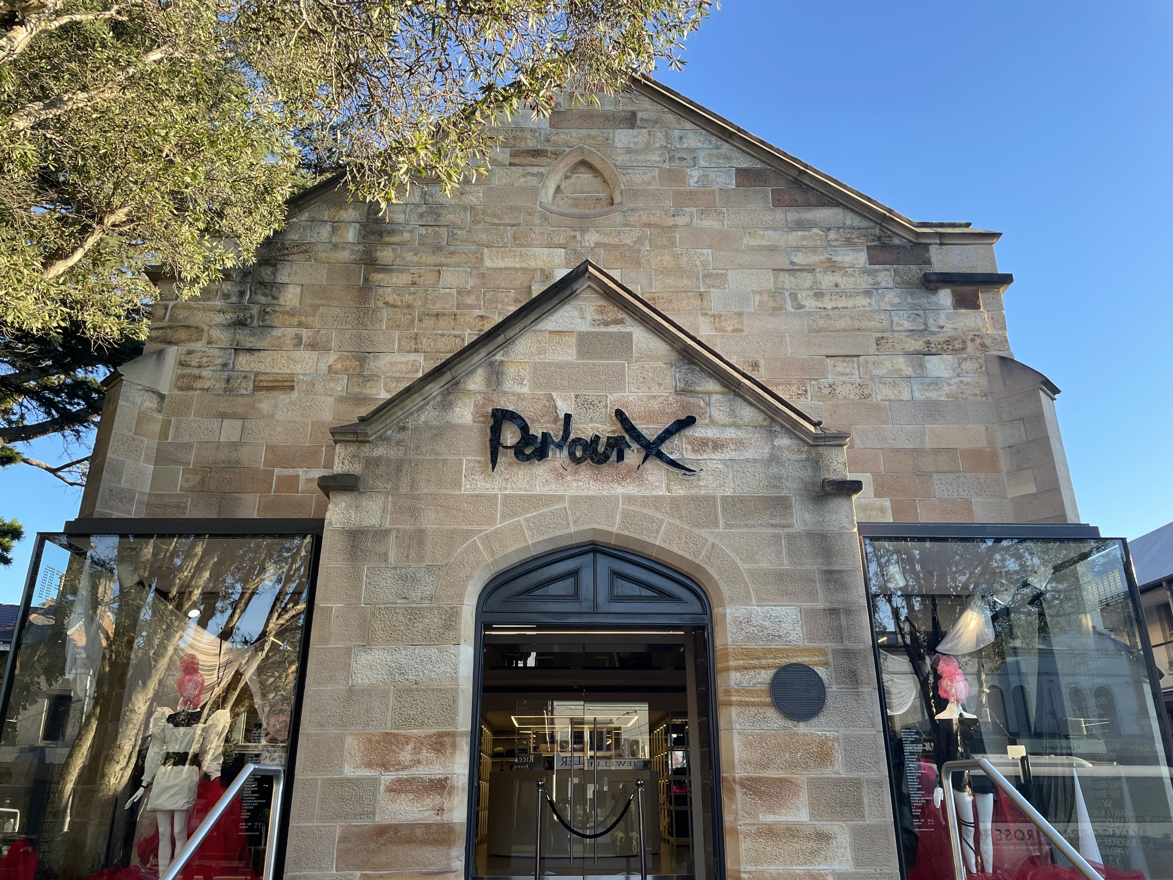 historic stone church like building now a boutique with Parlour X written at entrance