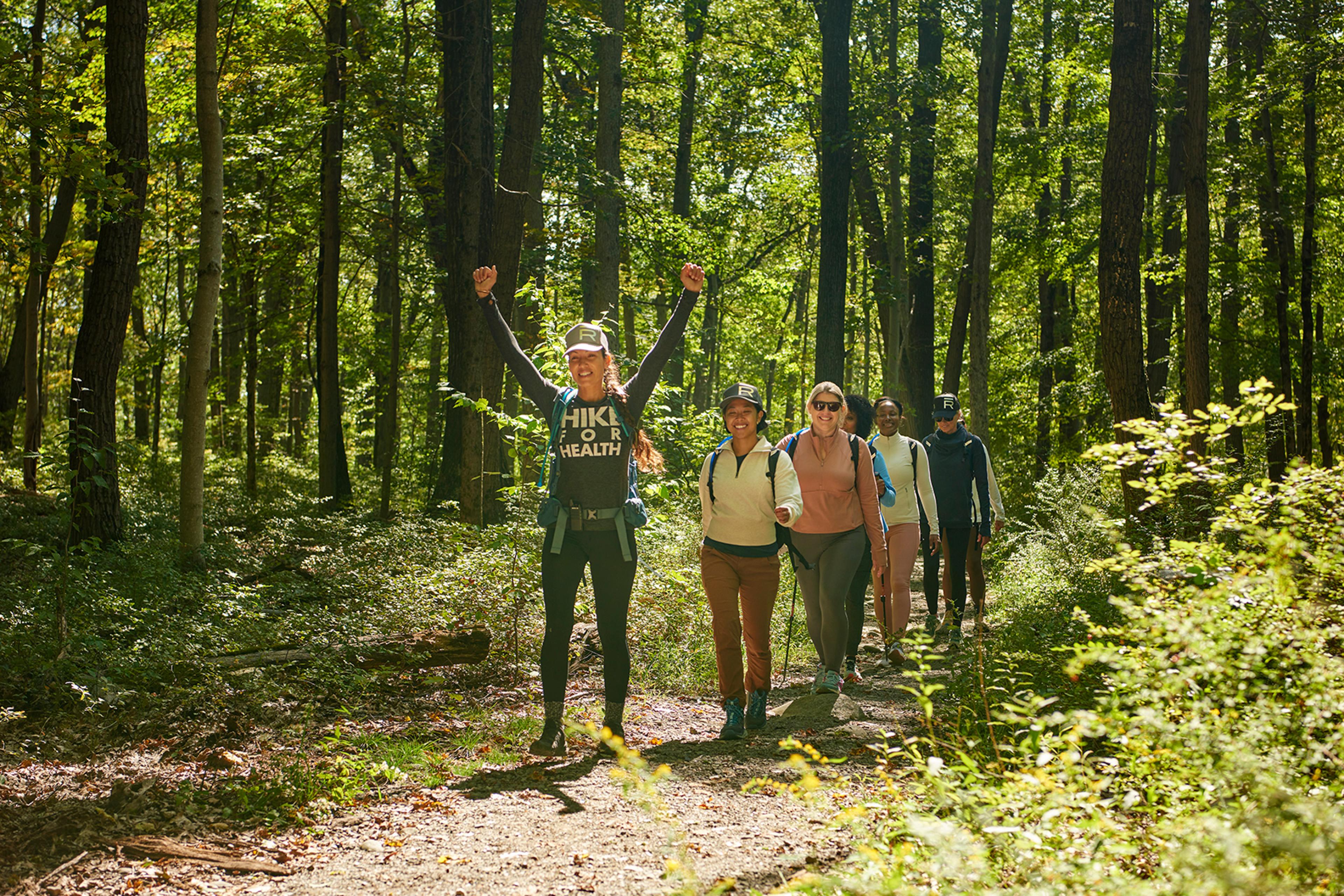 group of women hiking in the woods