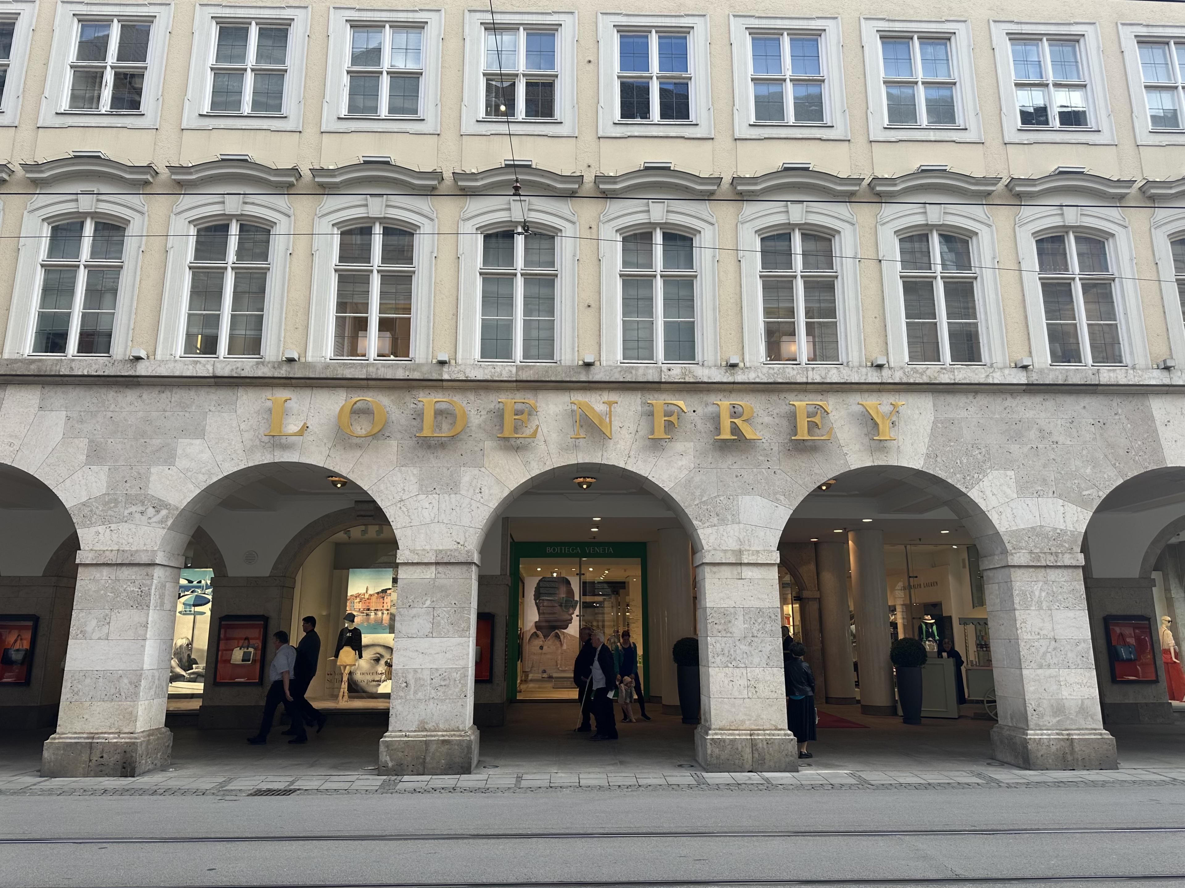 Exterior of Loden Frey with stone archways and gold lettering 