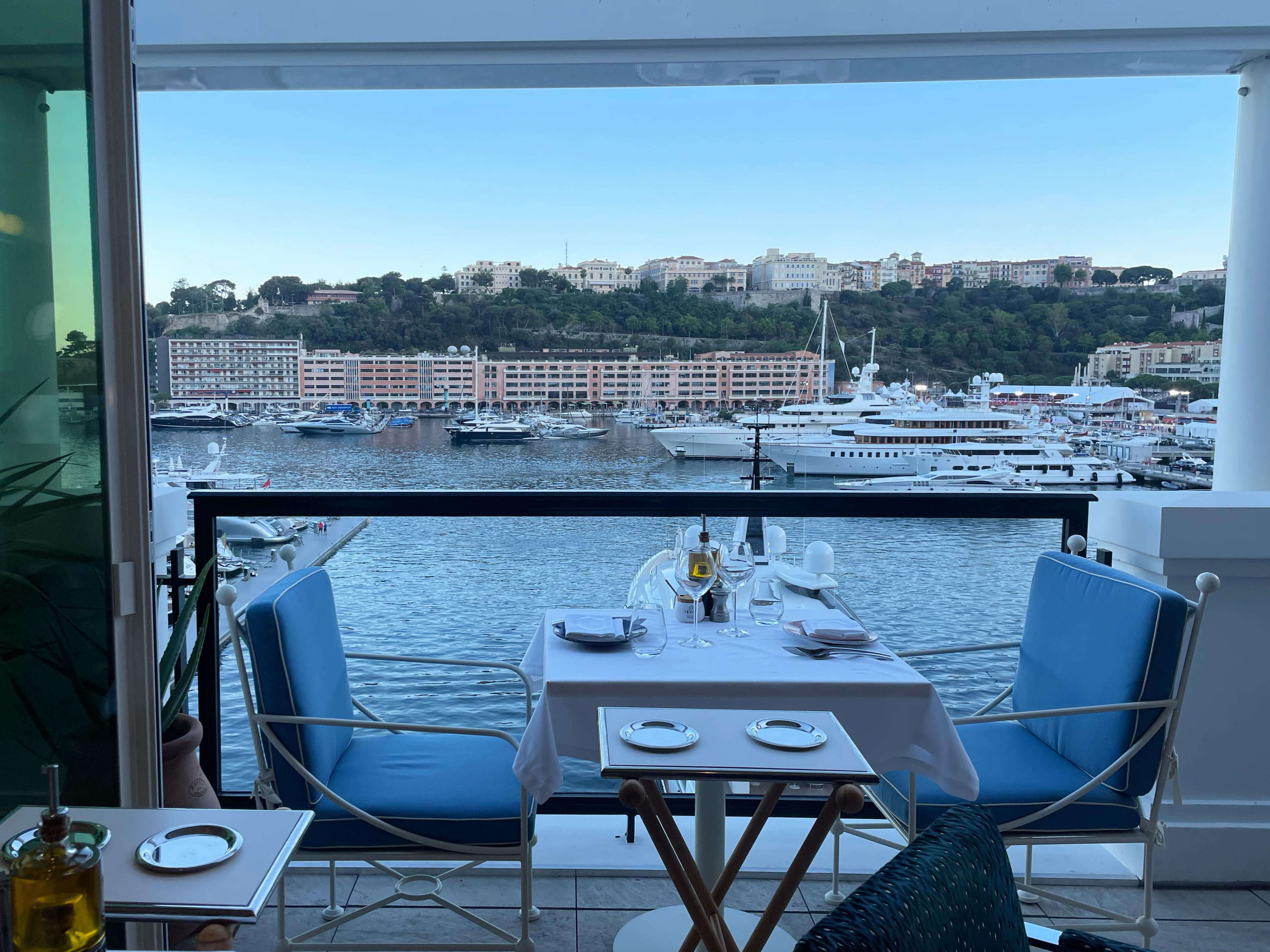 restaurant terrace seating at dusk with view over water