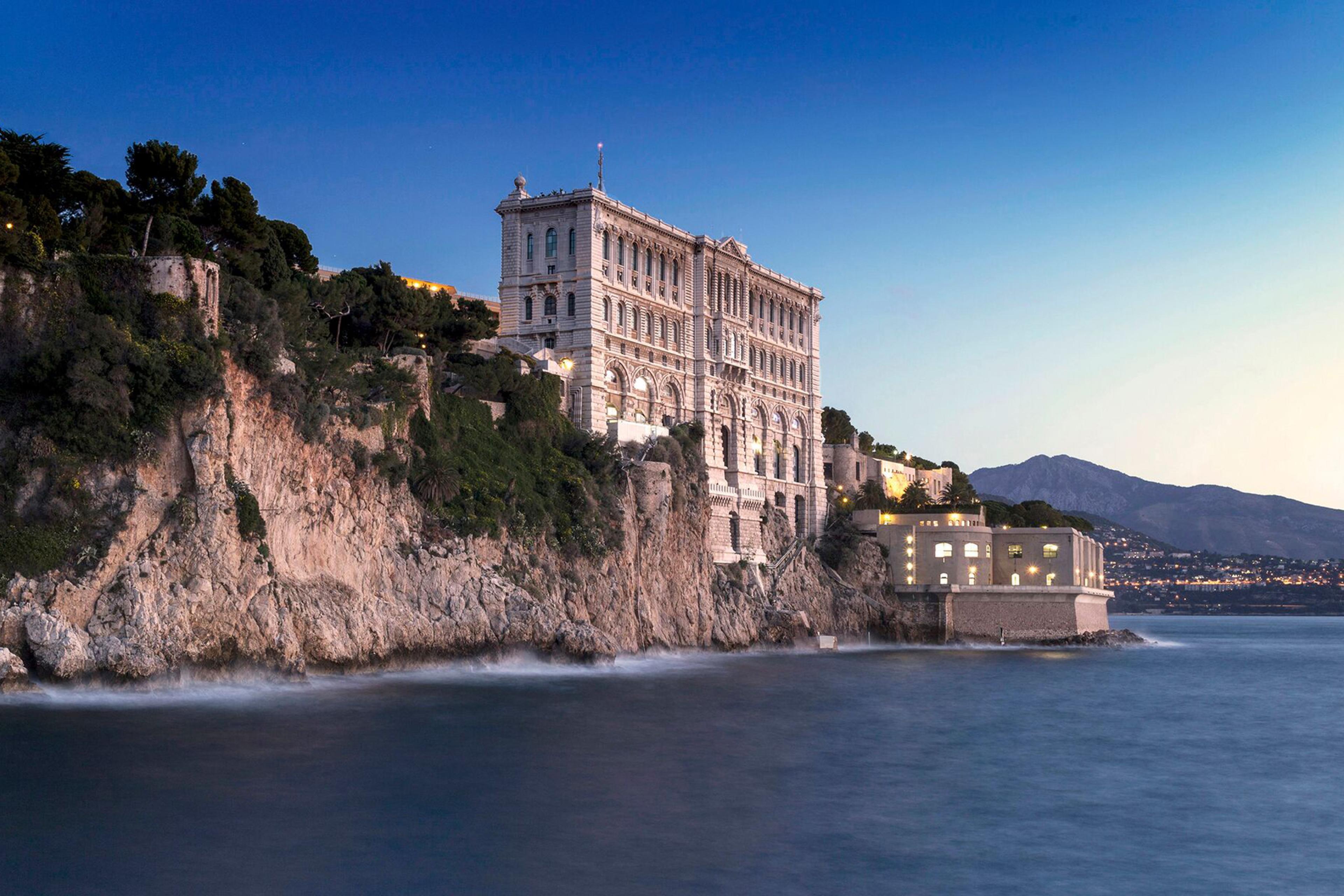 tall building built into the cliff on the coast