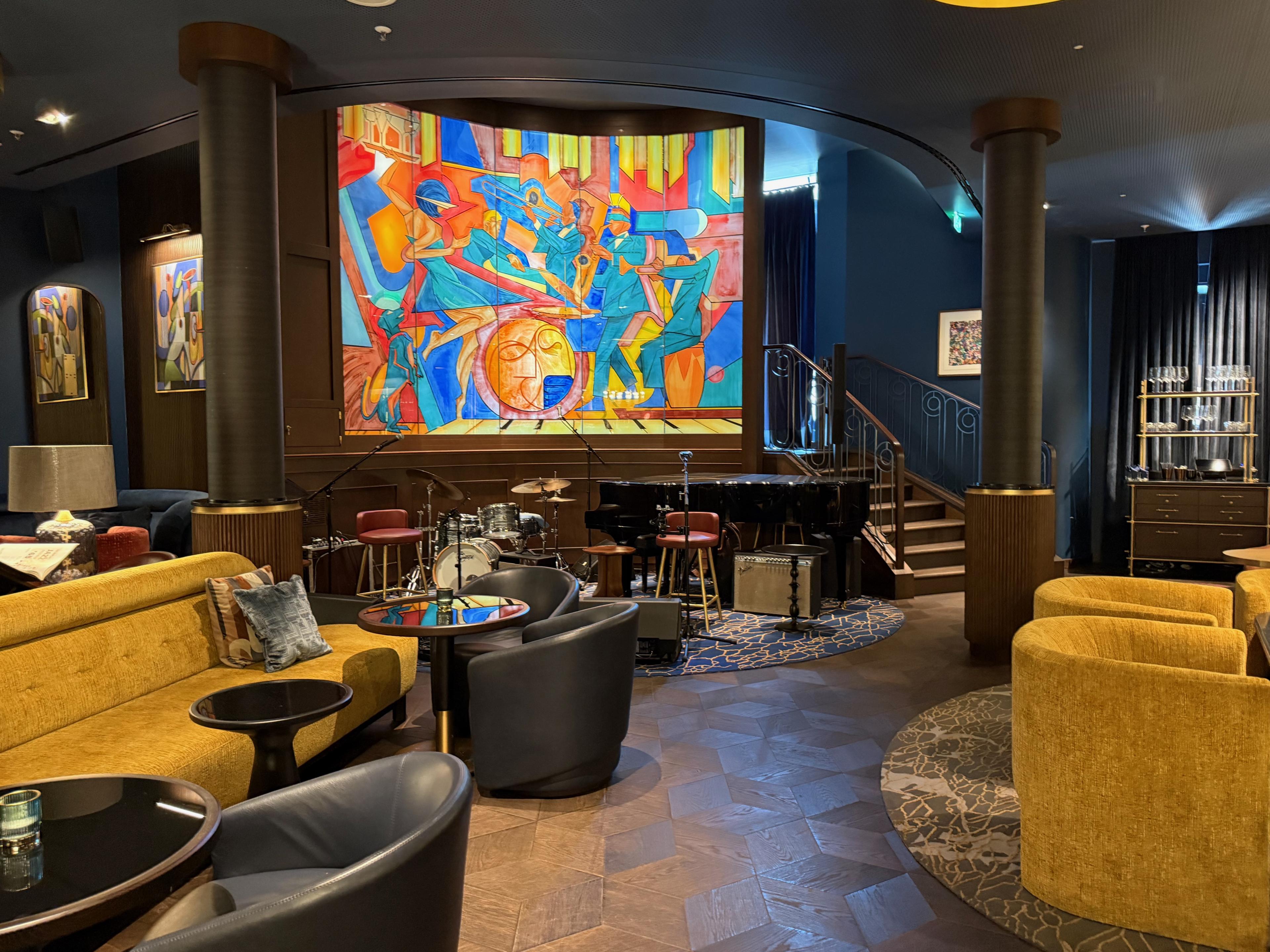 jazz bar with stain glass window behind stage