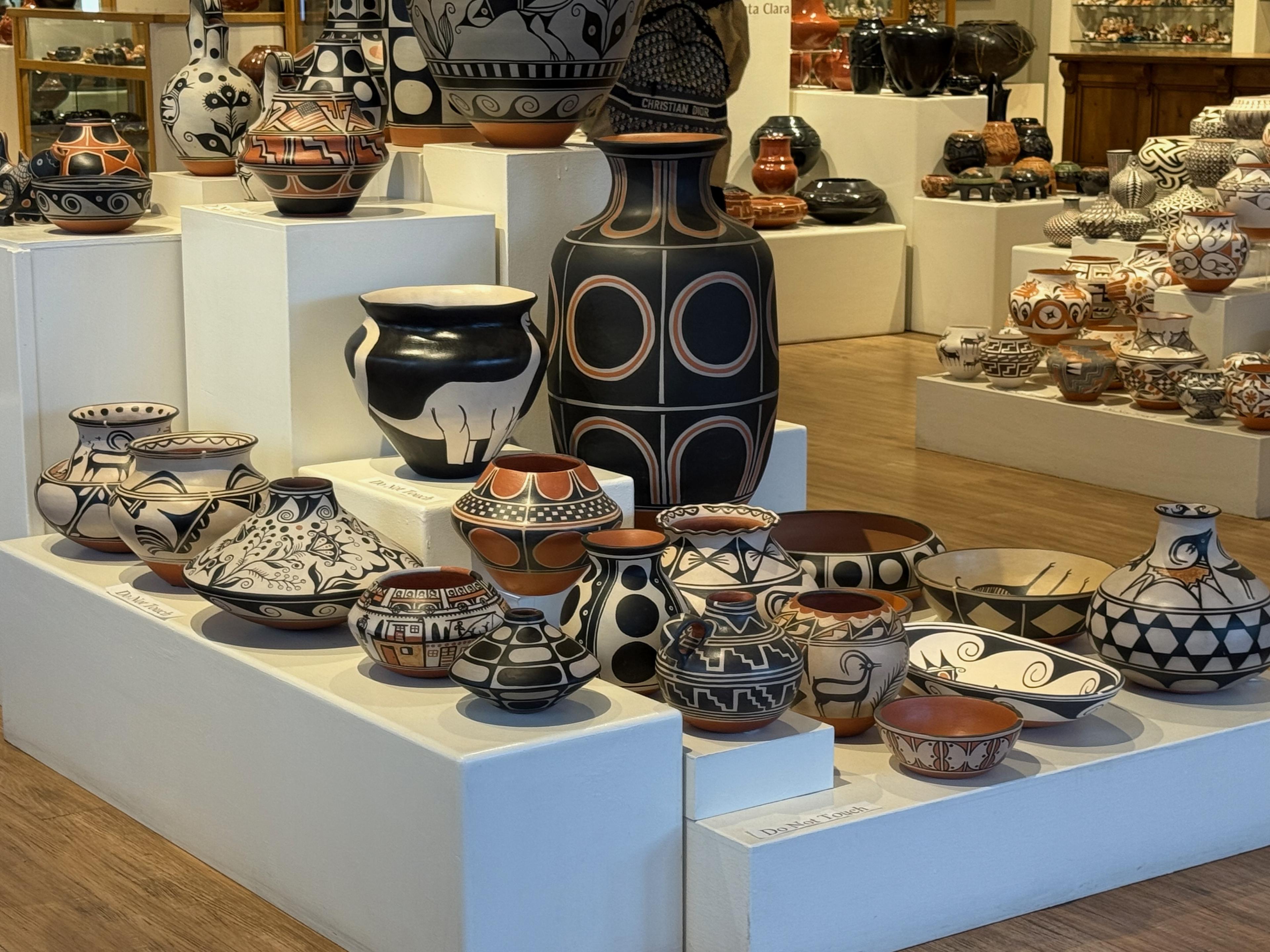 store display of pottery in a variety of shapes, sizes and designs 